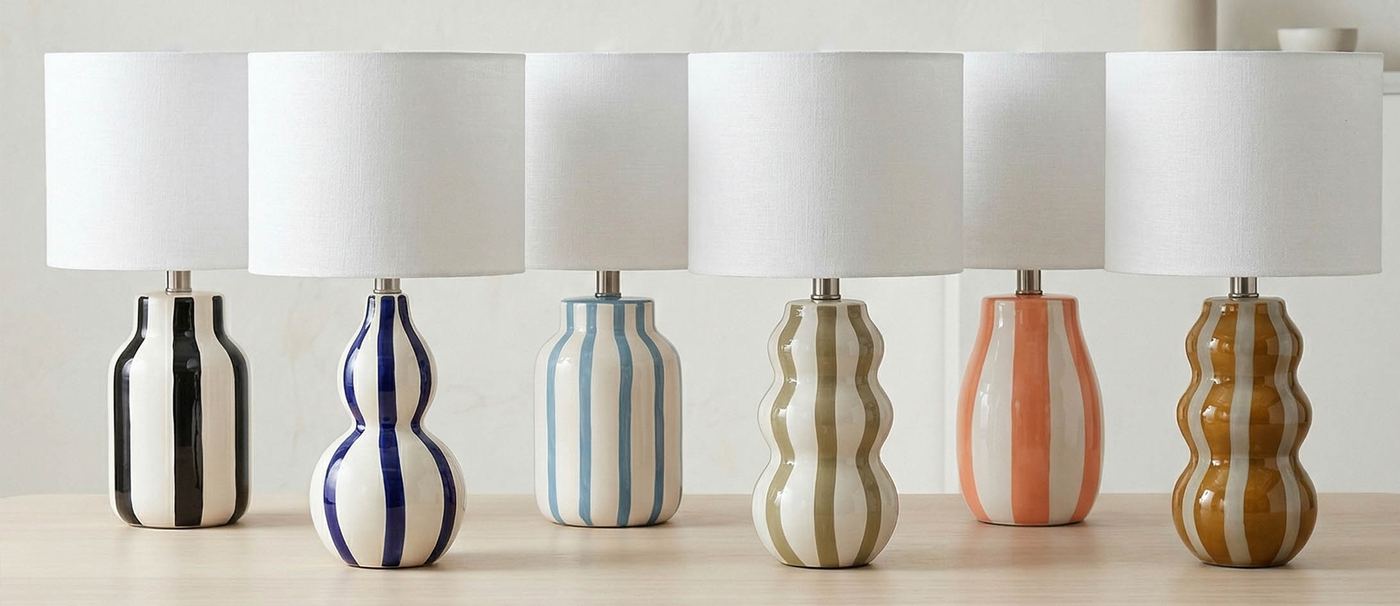Artistic ceramic table lamps with colorful vertical stripes in varied shapes